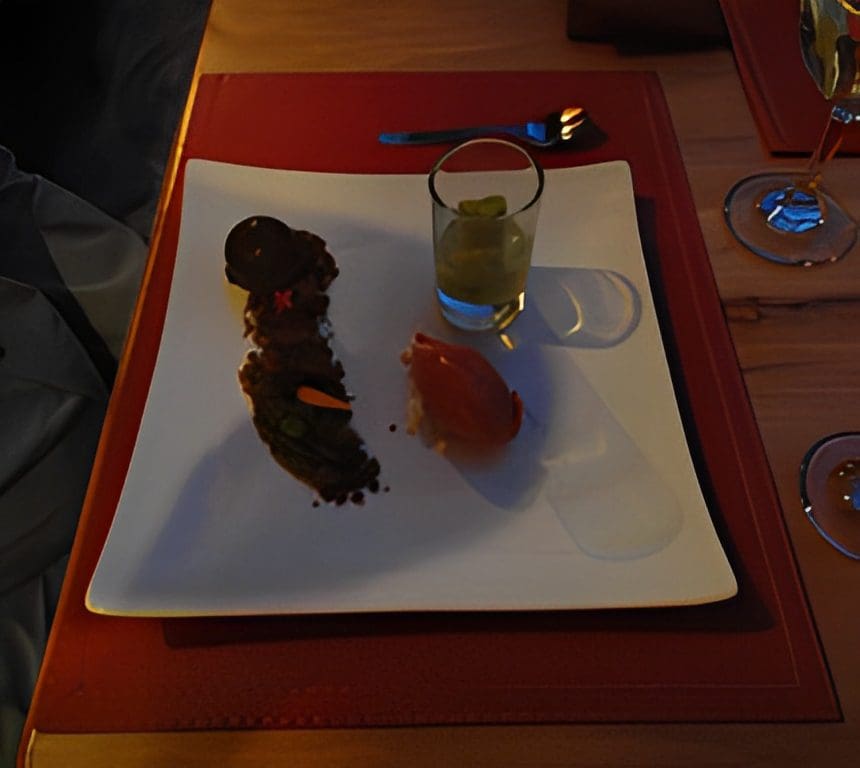 Gourmet dessert plate with three items.